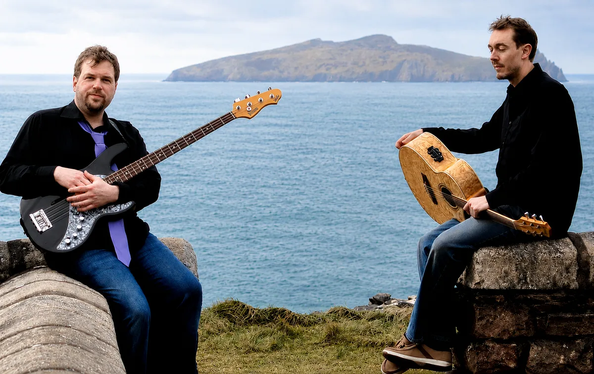 Dave and Tom with their instruments overlooking the Atlantic coast near Dingle